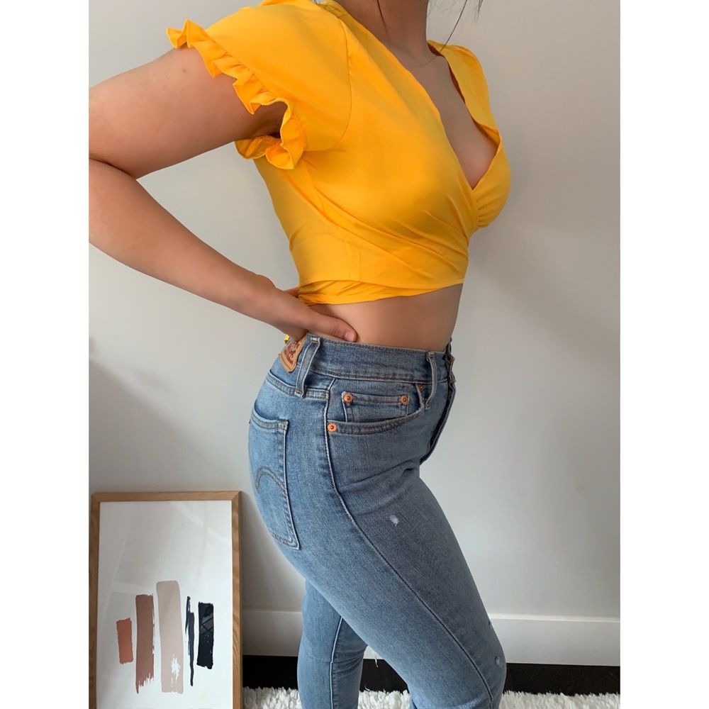 yellow wrap around top with ruffled sleeves